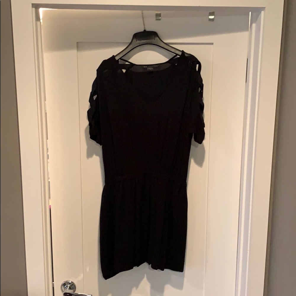 A/X mini dress with lattice cutout sleeves.